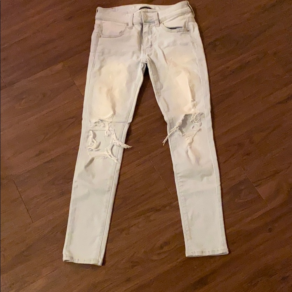 Super stretchy holey light-washed skinny jeans